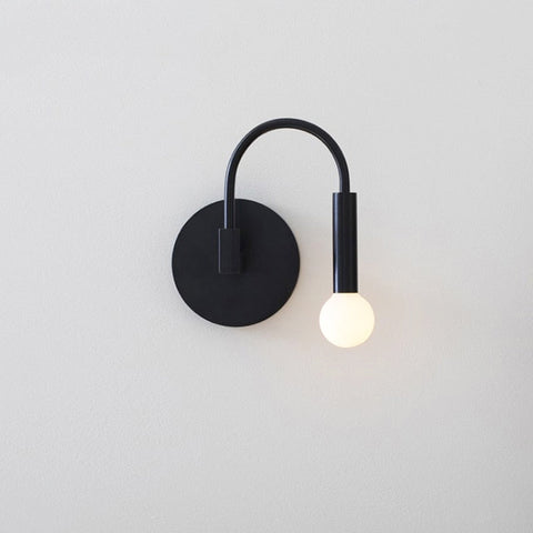 Wall Sconce with Curved Metal Arm and Rotating Exposed Bulb Holder