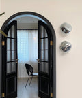 Glass Wall Sconce with Metal Frame and Sculptural Shade — product view