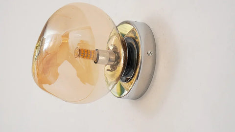 Glass Wall Sconce with Metal Frame and Sculptural Shade — product view