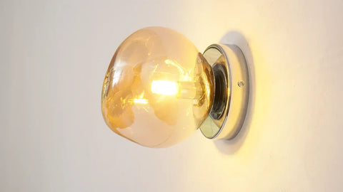 Glass Wall Sconce with Metal Frame and Sculptural Shade — product view