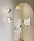 Glass Wall Sconce with Metal Frame and Sculptural Shade — product view