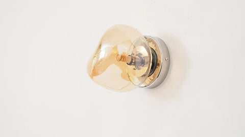 Glass Wall Sconce with Metal Frame and Sculptural Shade — product view