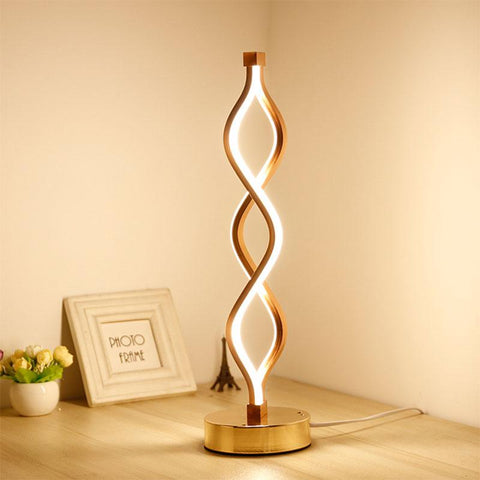 Sculptural Gold LED Table Lamp with Twisted Loop Design and Integrated Lighting